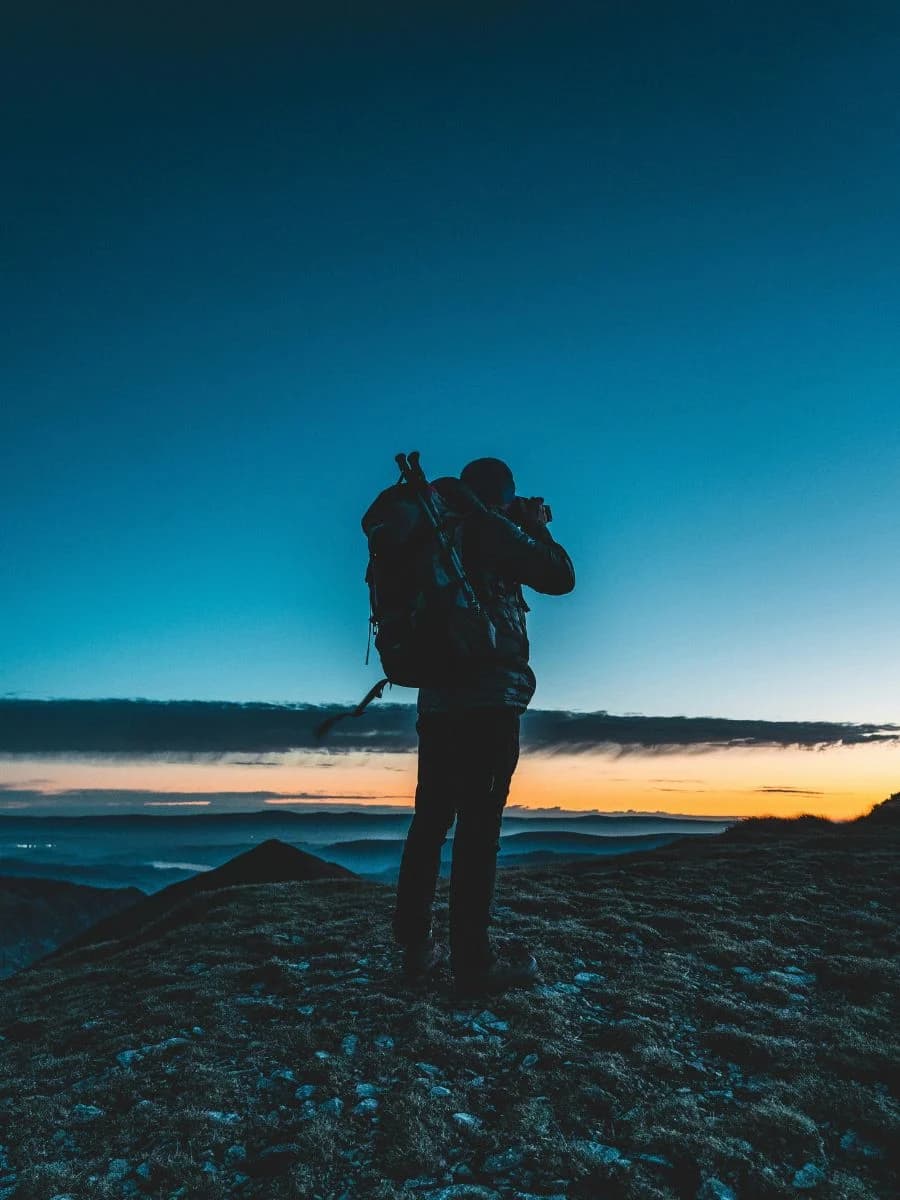 Outdoor content creator filming on a trail.